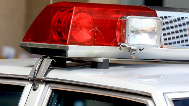 Close up of a police siren with flashing lights 