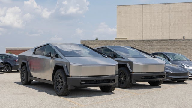 Tesla Cybertruck display at a dealership. Tesla offers the Cybertruck with driving range of up to 340 miles. MY:2024 