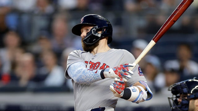 Trevor Story #10 of the Boston Red Sox hits a 2-run double during the third inning against the New York Yankees at Yankee Stadium on June 7, 2025 in New York City. 