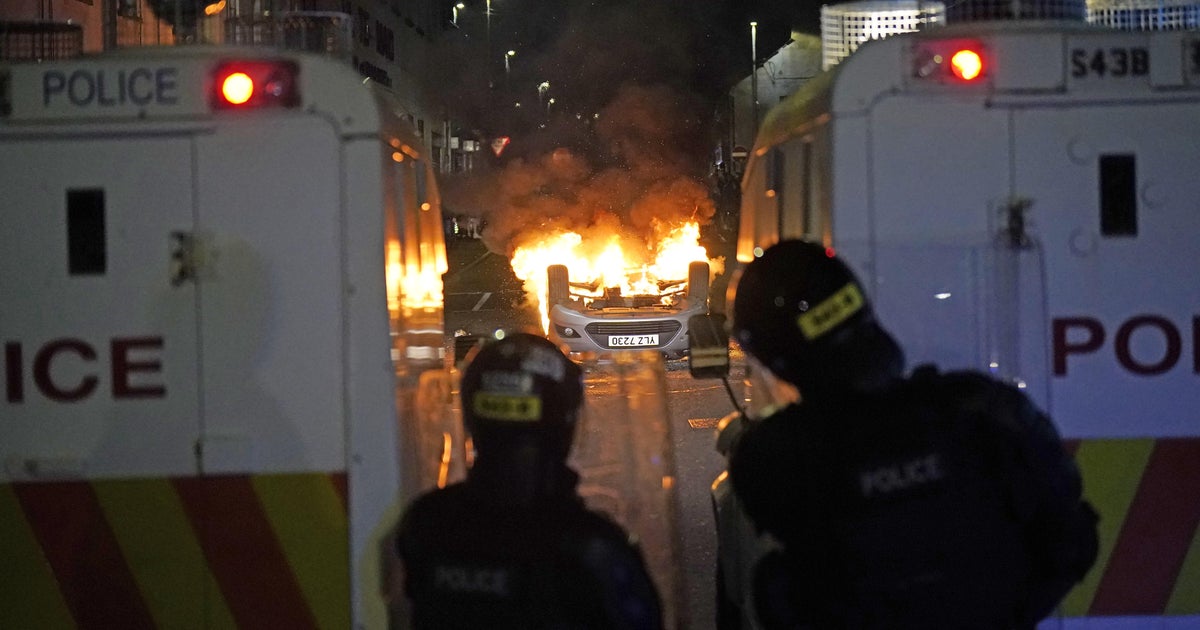 Police condemn "hate-fueled acts and mob rule" in Northern Ireland unrest 